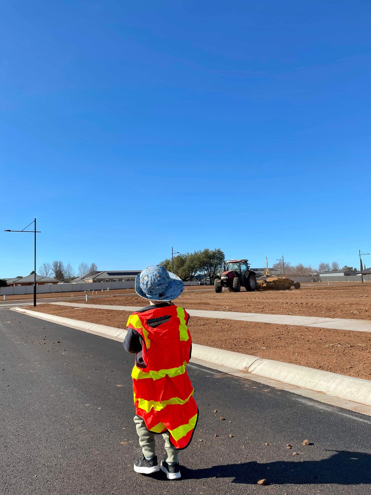Whitfield Excavations team member in full PPE on a newly constructed road